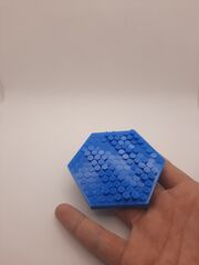 hex fidget with fingers.jpg