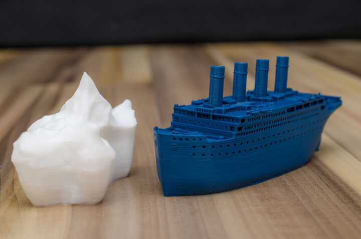 Small compressed Titanic and scale example of the iceberg